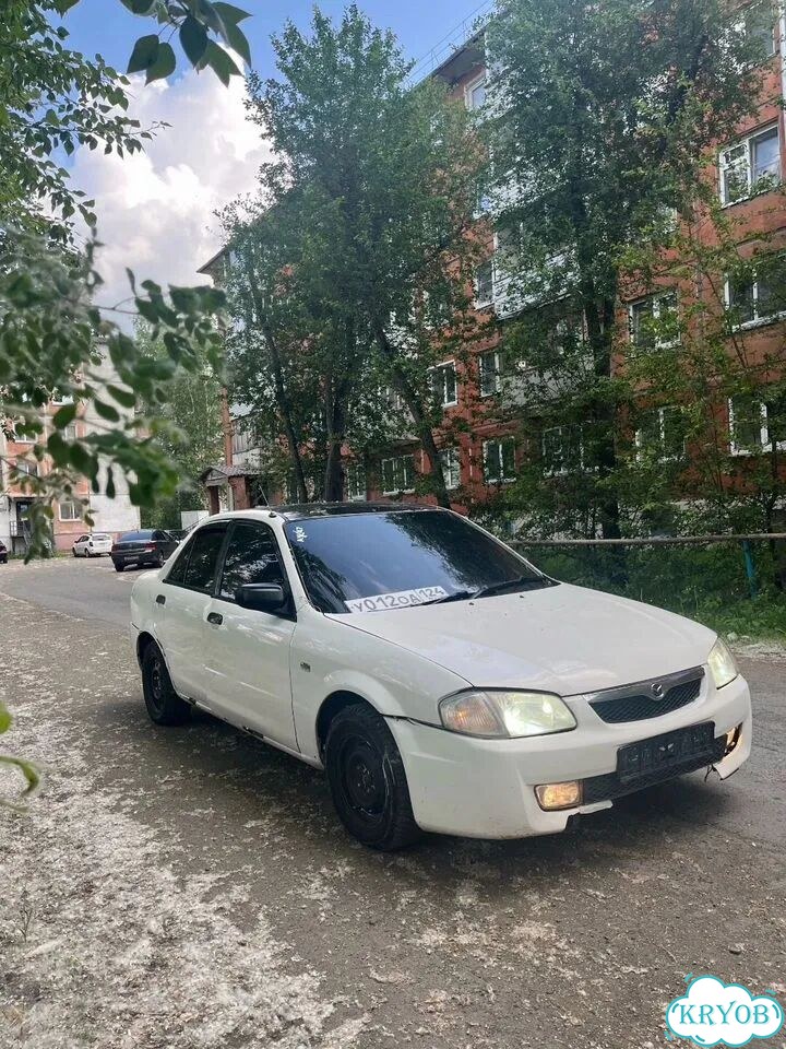 Mazda familia автомобиль фото 2