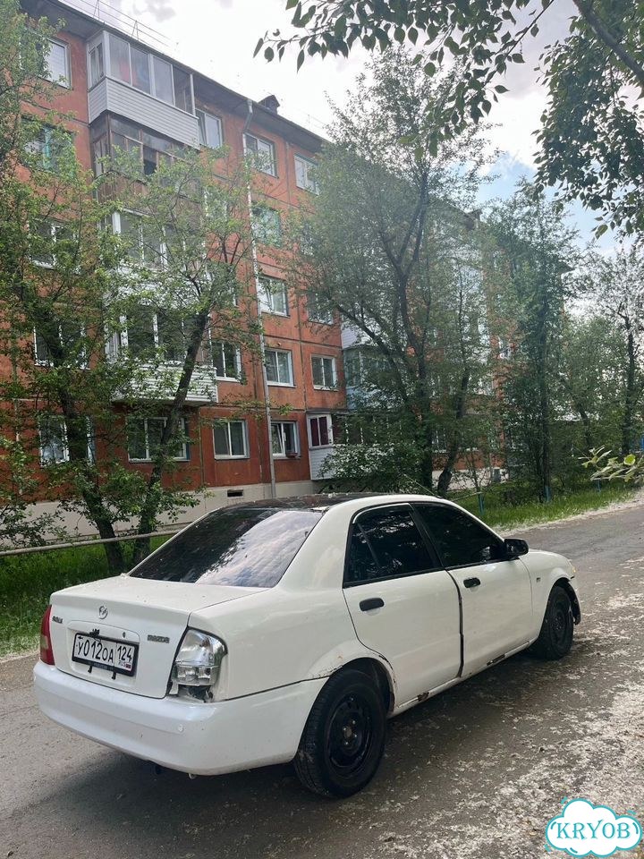 Mazda familia автомобиль фото 3
